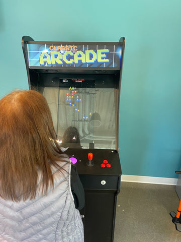 Girl Playing Classic Arcade Cocktail Table Machine
