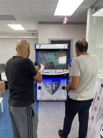 Men Playing with arcade machine