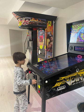 Child Playing Virtual Pinball