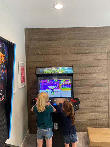 Girls Playing Arcade Game.