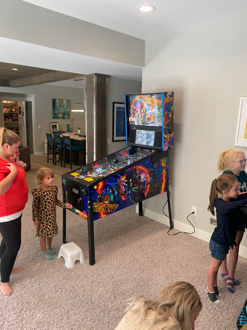 People With Pinball And Arcade Machines