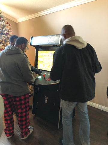 People Playing With arcade machine