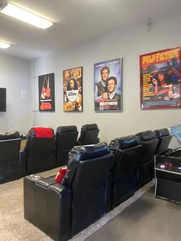 Home Theater With Movie Posters And Recliners.
