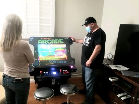 People Near Arcade Machine