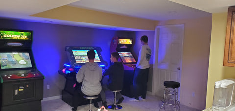 Men Playing Arcade Games